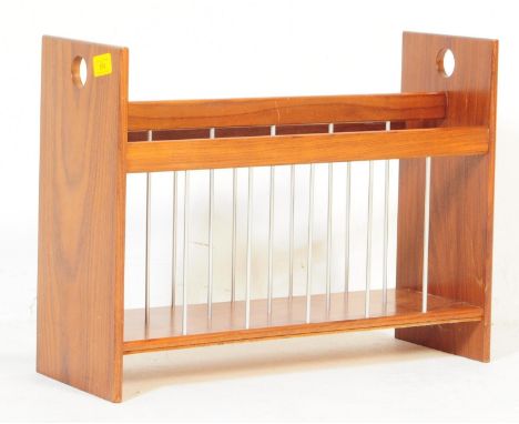 A retro vintage mid 20th Century teak wood magazine rack / holder. Having upright supports to either side, two sectioned stor