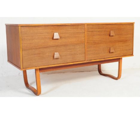 A retro vintage mid 20th century teak veneered quadrille style sideboard. Of rectangular form having four drawers with contra