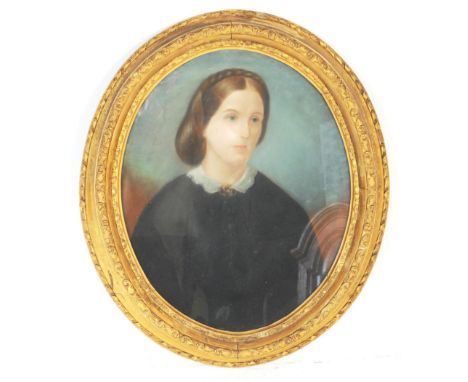 A Victorian 19th century oil on board portrait study painting. Of oval form depicting a woman with braided hair, with lace co