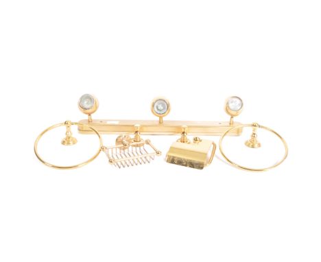 A selection of contemporary high end designer bathroom wears comprised of two gold toned brass towel ring holders and wall mo