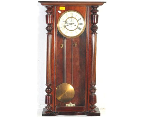 A Victorian 19th century German Gustav Becker mahogany Vienna regulator 8-day wall clock. Large glass window with decorative 