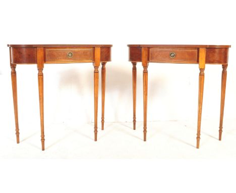 A pair of vintage 20th century regency revival burr walnut crossbanded console tables. Of rectangular form with curved front 