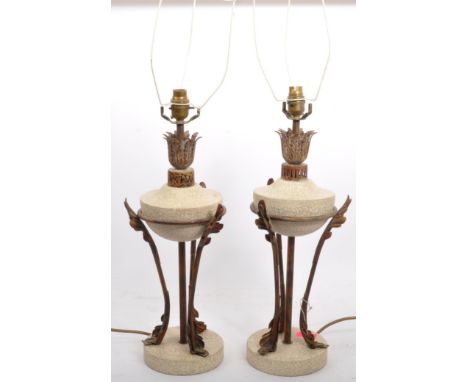 A pair of vintage 20th Century Hollywood Regency style stone and brass table top lamp bases. With foliate decoration atop a f