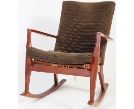 A retro vintage mid 20th century Parker Knoll teak wood rocking chair. Having with dark fabric cushioned seat and back rest w