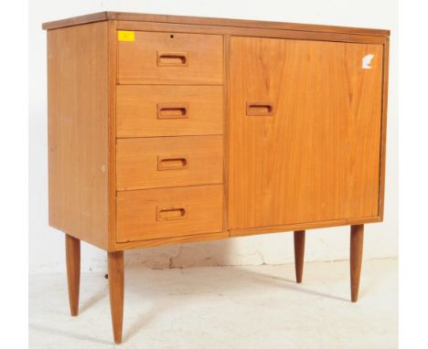 A retro vintage mid 20th century teak hall sewing machine cabinet. Of rectangular form with bank of four to left side and sin