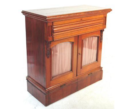 19th century Biedermeier mahogany pier cabinet - sideboard credenza. Raised on a deep plinth base with twin curtain lined dra