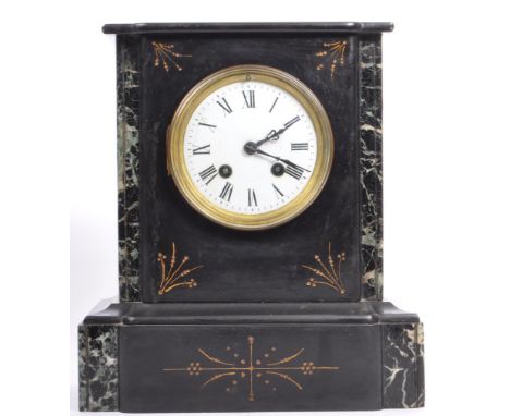 A 19th century Victorian era slate mantel clock. The mantle clock having enamelled whiter face with black roman numeral to ch