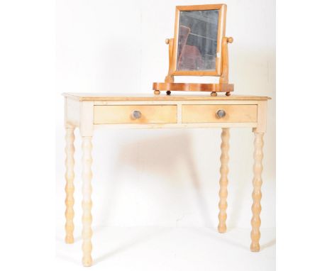 A 19th Century Victorian country pine writing table / desk. The desk having a flared top over double drawer with&nbsp; knob h