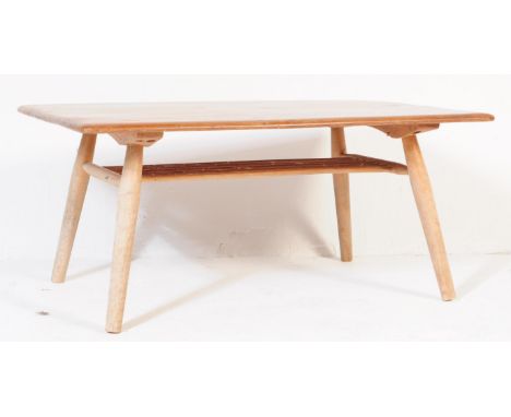 A retro vintage mid 20th century circa. 1960's teak coffee / occasional table. The table having rectangular top over rail und