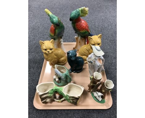 A tray containing pottery cat ornaments, Fowler ware vases, a pair of German parakeet figures, Nao figure, etc