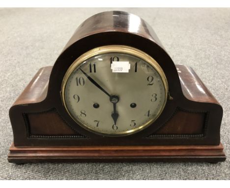 An early twentieth century mahogany mantel clock with silvered dial 