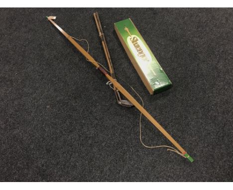 A Slazenger archery bow together with a box containing Slazenger arrows and three vintage hickory shafted golf clubs