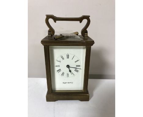 A brass cased Mappin and Webb Ltd mantel clock with key