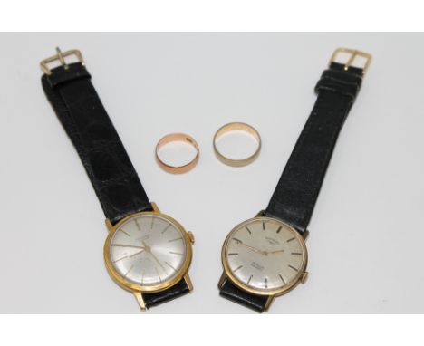 Two 9ct gold band rings, 5.3g gross. Together with a gent's gold plated Rotary wristwatch and another signed Universal Geneve