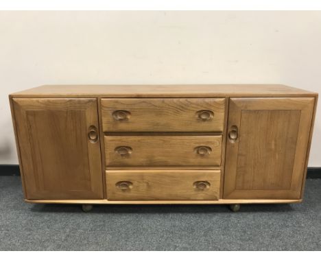 An Ercol light elm low sideboard, width 155.5 cm 