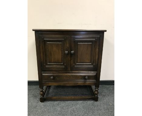 An Ercol dark elm double door cupboard, width 79 cm 