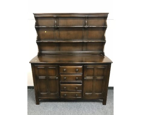 An Ercol dark elm dresser, width 146 cm 