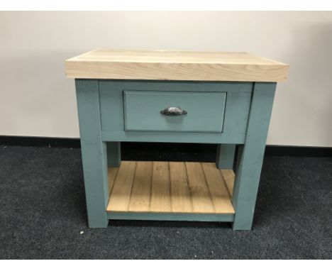 A reclaimed pine kitchen butchers block, fitted a drawer, with shelf beneath