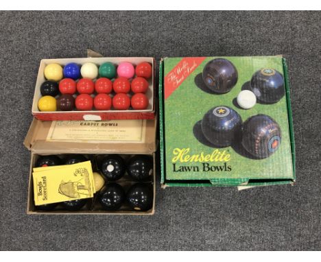 A set of boxed Henselite lawn bowls together with a set of boxed Banda carpet bowls and a set of Ambassador snooker balls  