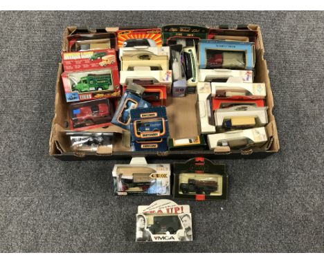 A box containing approximately twenty eight boxed die cast vehicles, Matchbox and Solido