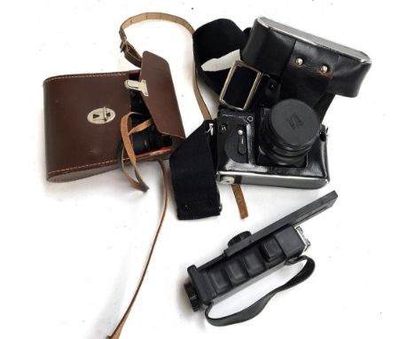 A Zenit EM 35mm camera, together with handle 