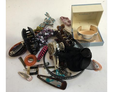 A quantity of costume jewellery, mainly hair clips and ties, and a Newbridge silverware bangle 