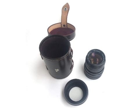 A Leitz Canada Tele-Elmarit f/2.8 90mm lens no.2585620, in leather lens case, no mould or fungus