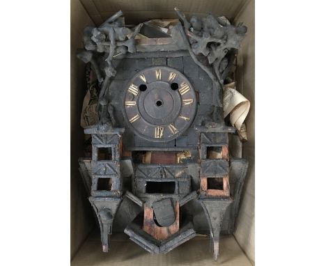 An unusual cuckoo clock, in need of repair, 40cmH, together with a later wall clock with gilt decoration 
