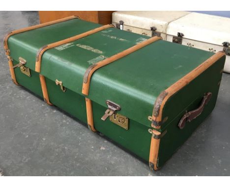 A vintage travel trunk with bamboo bracing and leather handles 
