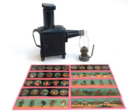 A German magic lantern, probably made by Plank, complete with oil lamp and glass, together with 10 coloured slides 