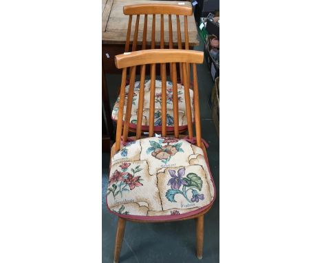 A pair of mid-century Ercol style stick back chairs 