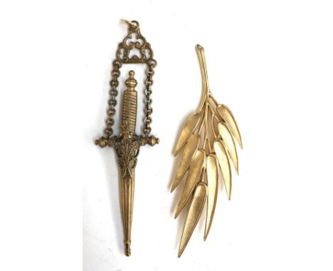 Button hook in the form of a dagger together with a Trifari brooch 