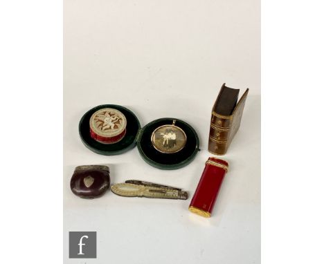 A 19th Century mother of pearl and red silk circular pin cushion, a similar pearl and silver folding fruit knife, a double st