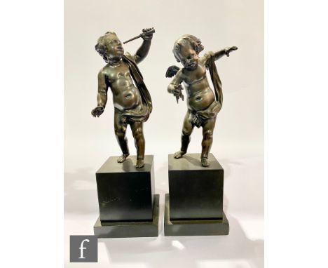 A pair of 20th Century bronzed figure of cherubs, one holding a telescope, the other a compass, each to a square slate plinth