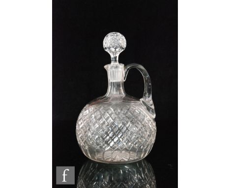 Two late 19th Century claret jugs, each of compressed spherical form with collar necks and applied loop handles, the first en