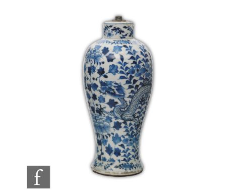 A Chinese 19th Century blue and white vase, of tapered ovoid form, rising from a splayed base, the body profusely decorated w