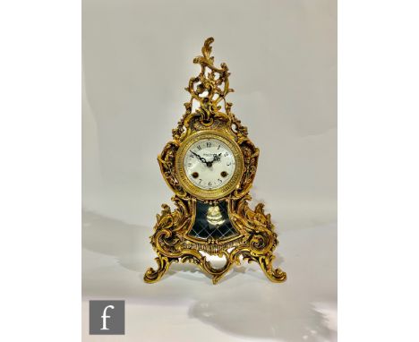 A late 20th Century mantel clock in the 19th Century French taste, with a lacquered brass case with acanthus scrolls and flor