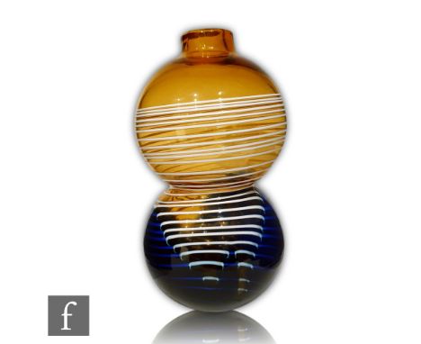 A Czechoslovakian glass vase by Jiri Suhajek, circa 1960s, of double gourd form with collar neck, in amber with opal trails c