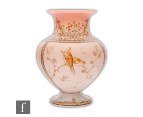 A late 19th Century continental Burmese glass vase of footed baluster form, enamel decorated with panels of flowering prunus 