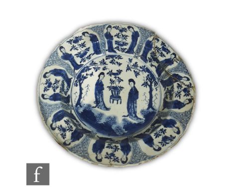 A Chinese blue and white Kangxi period (1662-1722) porcelain dish, the deep well extending to a wide everted rim, the central