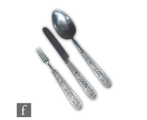 A George IV hallmarked silver knife, fork and spoon set with fine chased foliate scroll decoration to handles, Birmingham 182