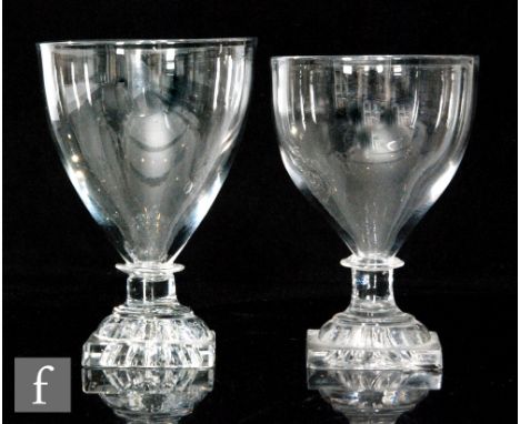 Two Georgian glass rummers, circa 1800, each with a round funnel bowl, raised to a collar and square moulded lemon squeezer f