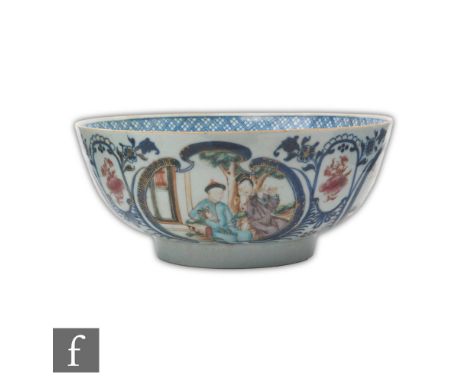 A Chinese 18th Century blue and white bowl, the exterior side with fan shaped panels detailed in Mandarin enamels depicting v