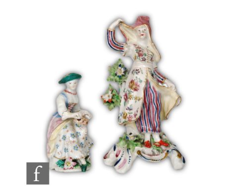 Two 19th Century Derby figures, the first modelled as a seated lady winding a musical instrument, height 12cm, the second a l