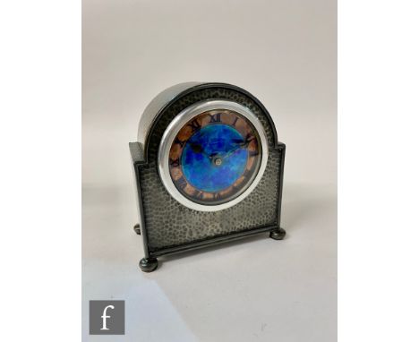 A Liberty pewter mantle clock of dome form with circular blue dial within a copper finish chapter ring, later aluminum bezel 