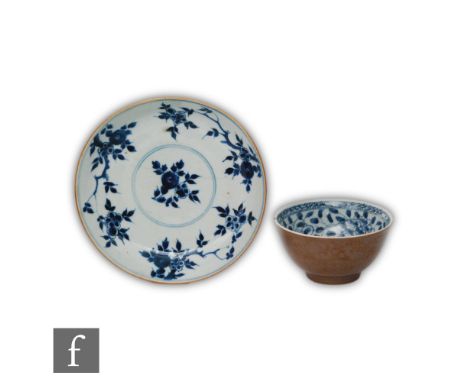 A Kangxi period (1662-1722) 'Cafe au lait' dish, the circular deep welled dish with brown glaze to the exterior sides, the in