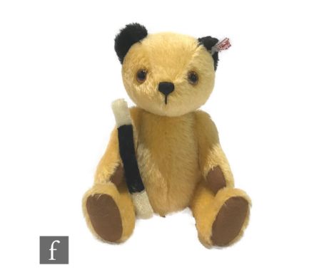 A Steiff Sooty teddy bear, from Harry Corbett's Sooty Show, white tag 663932, apricot mohair teddy with black mohair ears, li