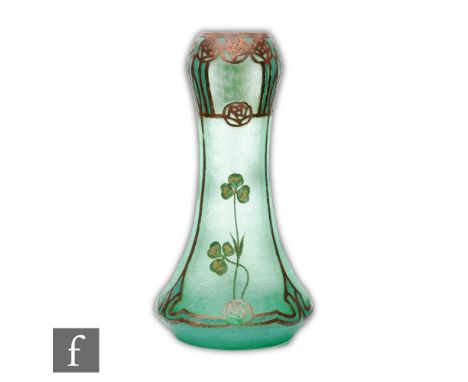 A late 19th Century continental cameo glass vase of tapering form, green cased over uranium green and cut with Mackintosh sty