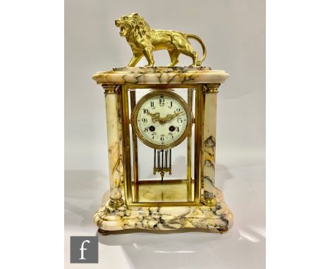 A late 19th to early 20th Century French four-glass mantel clock, the pink veined marble and bevelled glass case surmounted b