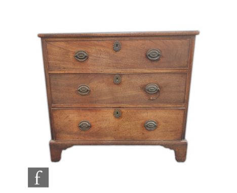 A George III mahogany straight front chest of three long drawers, oval brass drop handles, on bracket feet, height 79cm x dep